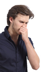 Man holding his nose because of the stink