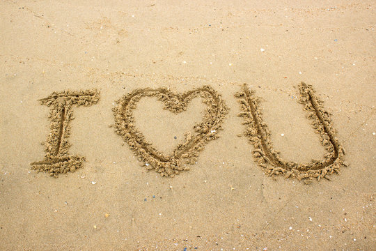 i love you text on sand