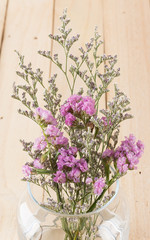 statice flower bouquet  on wood background