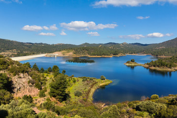 Obraz premium blue lake among a forest