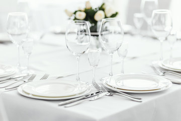 Wedding table with white roses.