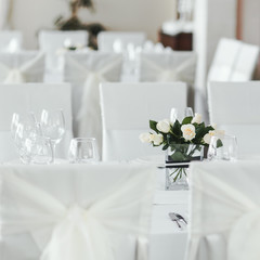 Wedding table with white roses.