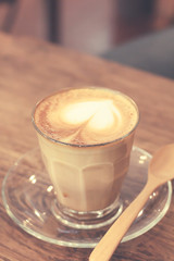 Cup of coffee latte art on wood table