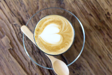 Cup of coffee latte art on wood table
