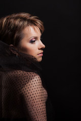Fototapeta premium Profile of beautiful woman on black