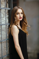 Fototapeta premium Attractive fashion woman in black dress