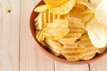 potato chips on wood background