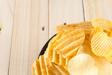 potato chips on wood background
