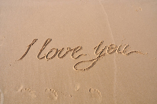 I love you drawing on beach sand