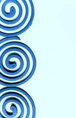 Blue spiral on blue background