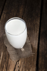 Milk on a dark wooden background