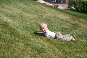 Portrait of a young boy lying