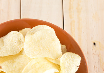 potato chips on wood background