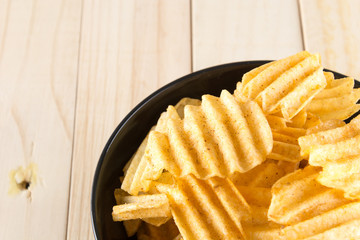 potato chips on wood background