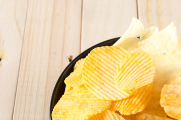 potato chips on wood background