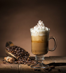 Glass cup with coffee beans