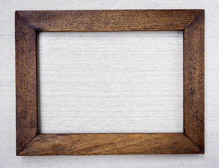 Wooden picture frame on canvas background