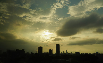 Fototapeta na wymiar silhouette photo of Moden City with Sunset Sky