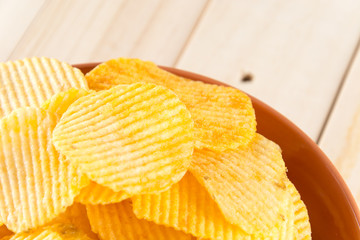 potato chips on wood background