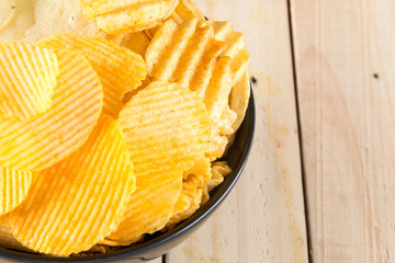 potato chips on wood background