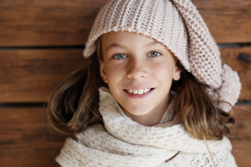 Child posing in knitted clothing