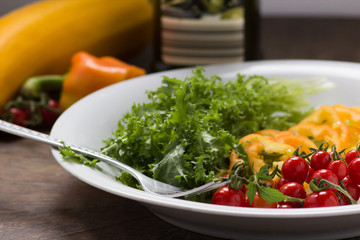 Cherry tomato with green salad  pepper and olive oil
