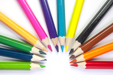 Fototapeta premium Line of colored pencils isolated on white background close up