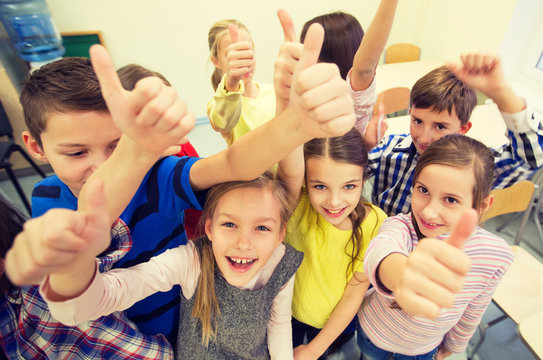 Group Of School Kids Showing Thumbs Up