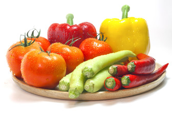 Mixed collection of fresh organic vegetables for healthy vegetarian food isolated on a white background.