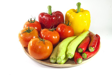 Mixed collection of fresh organic vegetables for healthy vegetarian food isolated on a white background.