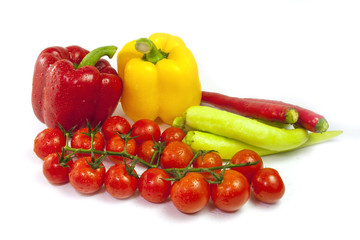 Mixed collection of fresh organic vegetables for healthy vegetarian food isolated on a white background.