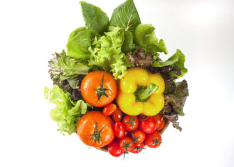 Mixed collection of vegetables isolated on a white background. Bowl of salad with fresh organic vegetables for healthy.