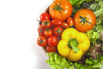 Mixed collection of vegetables isolated on a white background. Bowl of salad with fresh organic vegetables for healthy.