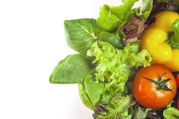 Mixed collection of vegetables isolated on a white background. Bowl of salad with fresh organic vegetables for healthy.