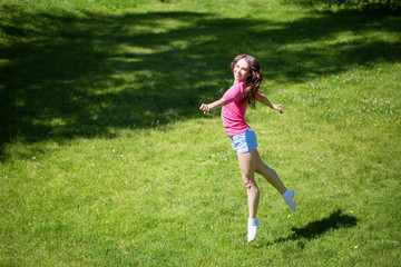 Woman jumping outdoors.