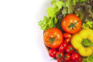 Mixed collection of vegetables isolated on a white background. Bowl of salad with fresh organic vegetables for healthy.