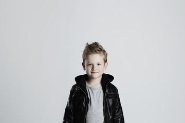 Fashionable child in leather coat.stylish little boy.Autumn funny kid
