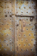 Old closed medieval metal door - concept image