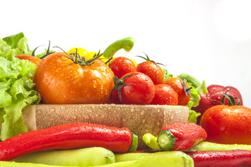 Mixed collection of vegetables isolated on a white background. Bowl of salad with fresh organic vegetables for healthy.