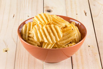 potato chips on wood background