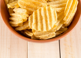 potato chips on wood background