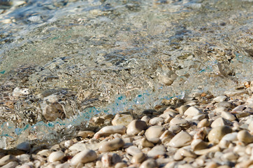 Sea wave on pebble beach