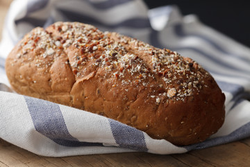 Dark multigrain bread whole grain fresh baked on rustic