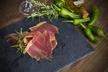 serrano ham with rosemary and peppers