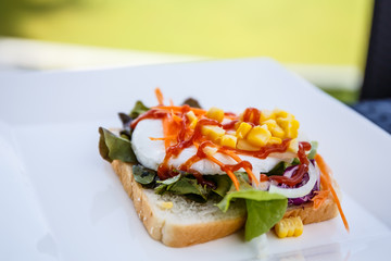 Salad bread and eggs on the table