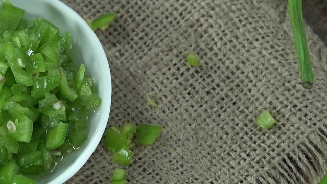 Chopped green Chilis (seamless loopable 4K footage)
