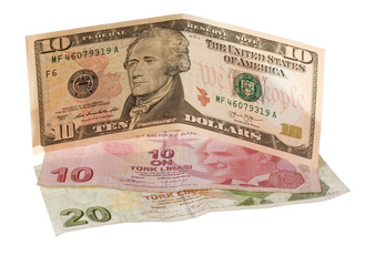 Finacial crisis: new dollars over crumpled turkish liras. Isolated on white.