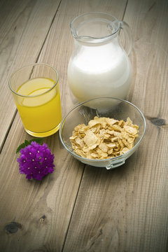 jug of milk, cereal and orange juice