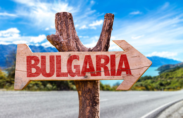 Bulgaria wooden sign with road background