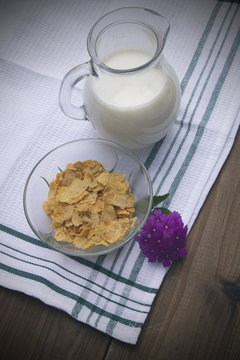 jug of milk, cereal and orange juice